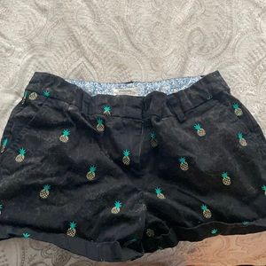 Pineapple designs on black shorts